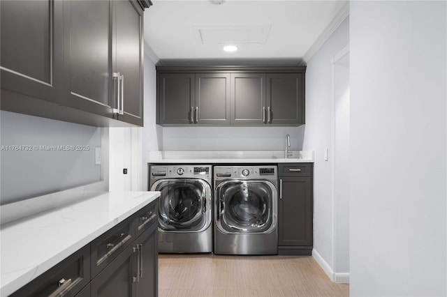 3916 Granada Blvd, Coral Gables, FL 33134 - clothes washing area featuring baseboards, attic access, a sink, cabinet space, and separate washer and dryer