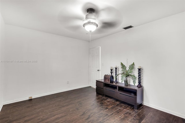 14841 Dade Pine Ave, Miami Lakes, FL 33014 - spare room featuring a ceiling fan, wood finished floors, and baseboards