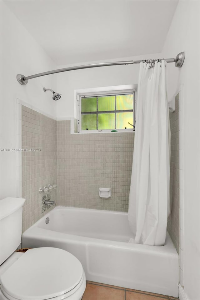 14841 Dade Pine Ave, Miami Lakes, FL 33014 - full bathroom with shower / tub combo, toilet, and tile patterned floors