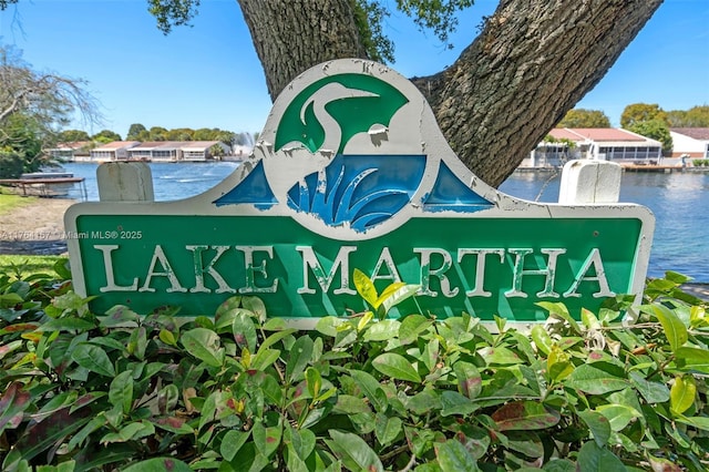 14841 Dade Pine Ave, Miami Lakes, FL 33014 - community / neighborhood sign with a water view