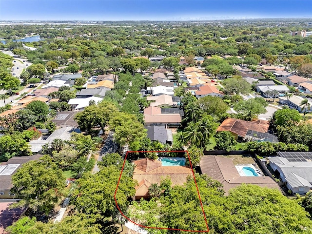14841 Dade Pine Ave, Miami Lakes, FL 33014 - aerial perspective of suburban area featuring a pool and property boundaries highlighted