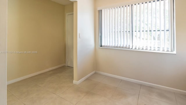 7401 NW 16th St Unit 207, Plantation, FL 33313 - spare room with baseboards and tile patterned flooring