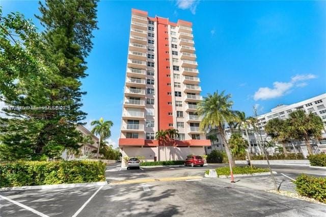 3161 S Ocean Dr Unit 708, Hallandale Beach, FL 33009 - view of building exterior featuring uncovered parking