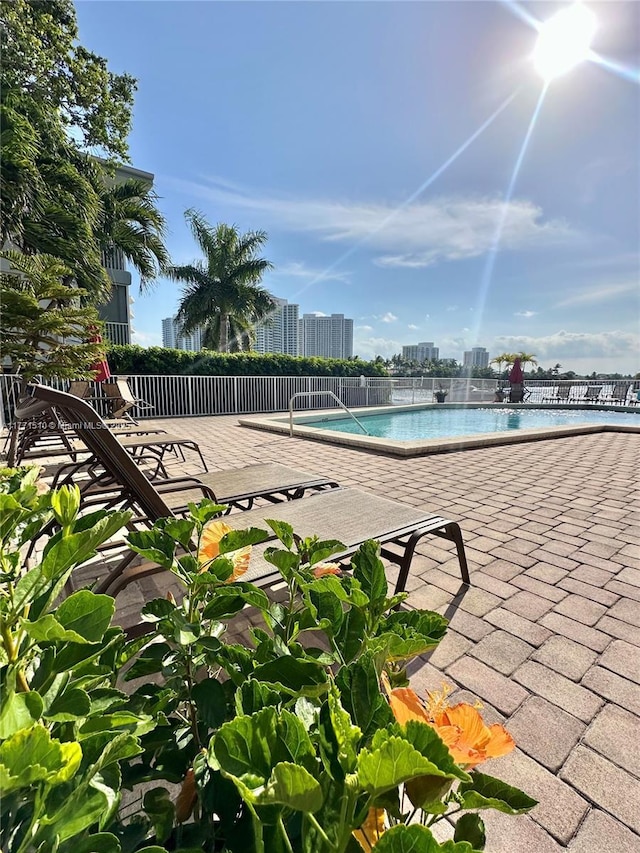 3161 S Ocean Dr Unit 708, Hallandale Beach, FL 33009 - pool with a city view, fence, and a patio