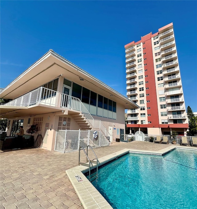 3161 S Ocean Dr Unit 708, Hallandale Beach, FL 33009 - community pool with fence, a patio, and stairway