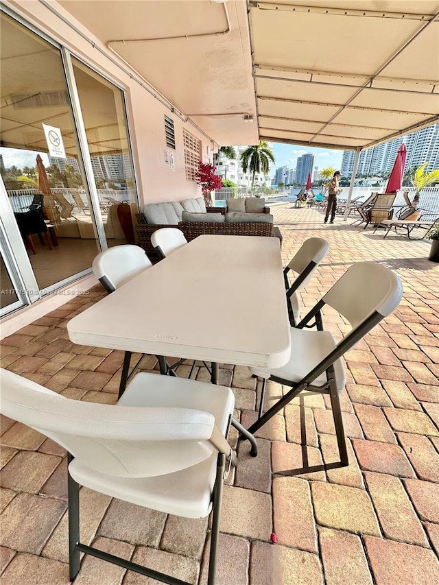 3161 S Ocean Dr Unit 708, Hallandale Beach, FL 33009 - view of patio / terrace featuring outdoor dining area and a view of city