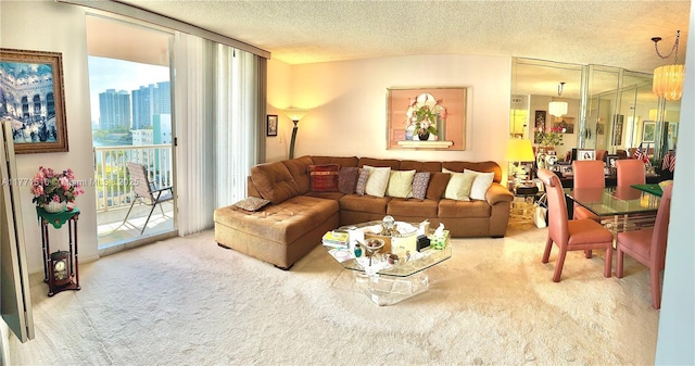 3161 S Ocean Dr Unit 708, Hallandale Beach, FL 33009 - living area featuring carpet flooring, a city view, a wall of windows, and a textured ceiling