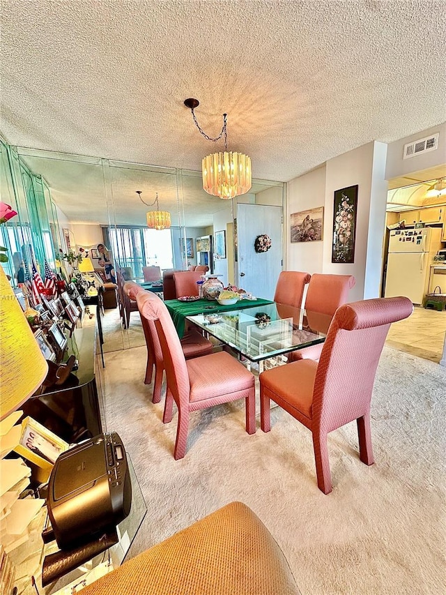 3161 S Ocean Dr Unit 708, Hallandale Beach, FL 33009 - dining room with visible vents, a notable chandelier, carpet flooring, and a textured ceiling