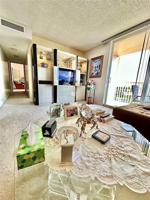 3161 S Ocean Dr Unit 708, Hallandale Beach, FL 33009 - carpeted living room featuring visible vents and a textured ceiling