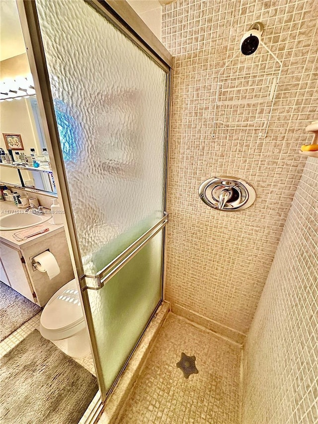 3161 S Ocean Dr Unit 708, Hallandale Beach, FL 33009 - full bathroom featuring tile patterned floors, toilet, a stall shower, and vanity