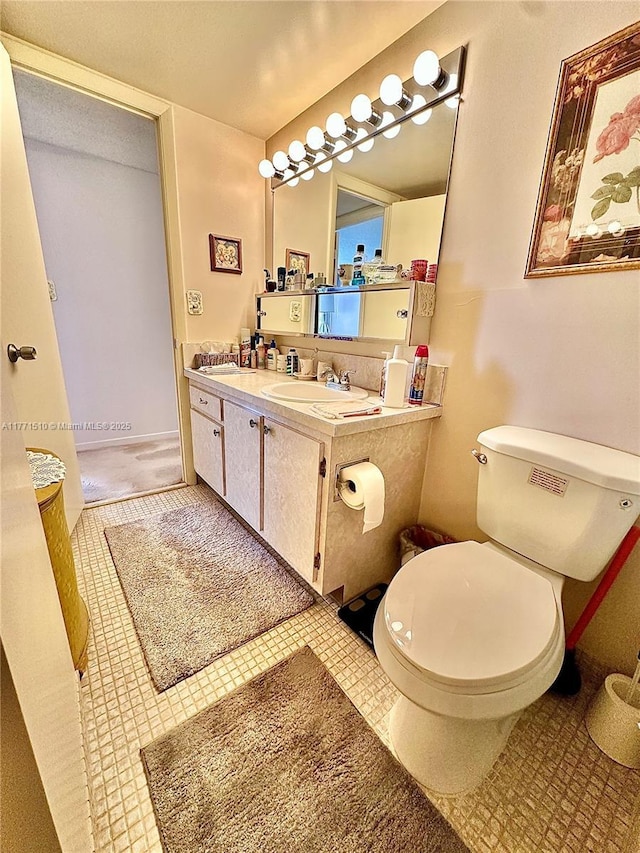 3161 S Ocean Dr Unit 708, Hallandale Beach, FL 33009 - bathroom featuring toilet, vanity, and tile patterned flooring