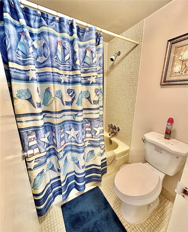 3161 S Ocean Dr Unit 708, Hallandale Beach, FL 33009 - bathroom featuring shower / tub combo with curtain, toilet, and tile patterned flooring