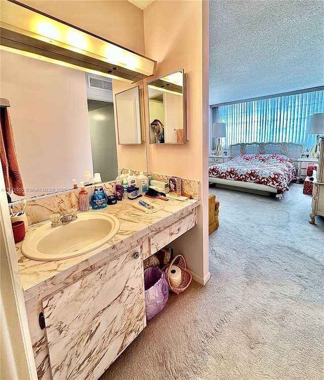 3161 S Ocean Dr Unit 708, Hallandale Beach, FL 33009 - bathroom featuring ensuite bathroom, a textured ceiling, visible vents, and vanity