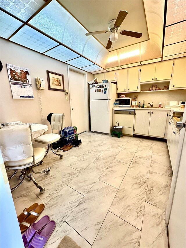 3161 S Ocean Dr Unit 708, Hallandale Beach, FL 33009 - kitchen featuring light countertops, open shelves, white appliances, cream cabinetry, and ceiling fan