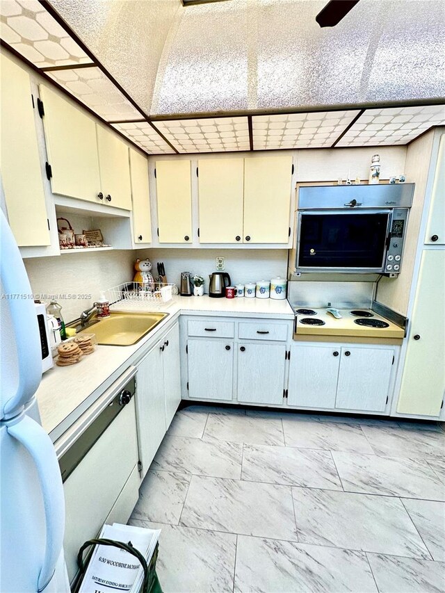 3161 S Ocean Dr Unit 708, Hallandale Beach, FL 33009 - kitchen with light countertops, open shelves, marble finish floor, a sink, and stovetop