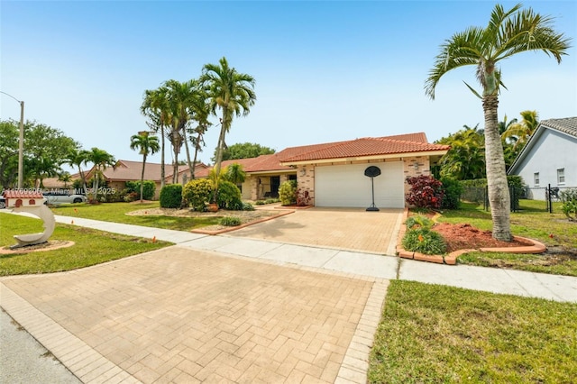 19460 NW 8th St, Pembroke Pines, FL 33029 - view of front of house featuring decorative driveway, a tile roof, an attached garage, and stucco siding
