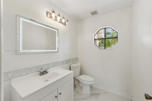 19460 NW 8th St, Pembroke Pines, FL 33029 - bathroom with vanity, marble look tile flooring, toilet, and baseboards