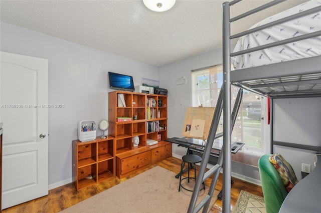 19460 NW 8th St, Pembroke Pines, FL 33029 - bedroom with wood finished floors, an office area, baseboards, and a textured ceiling