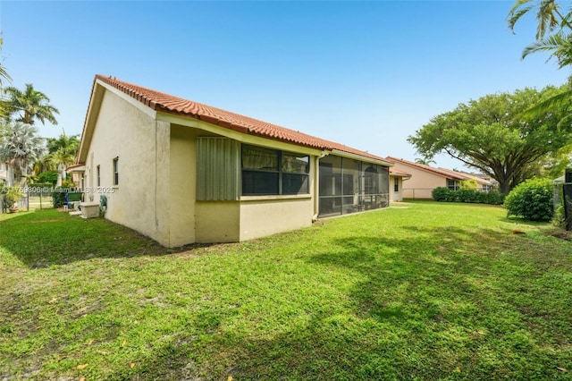 19460 NW 8th St, Pembroke Pines, FL 33029 - rear view of house with stucco siding, a sunroom, and a tile roof