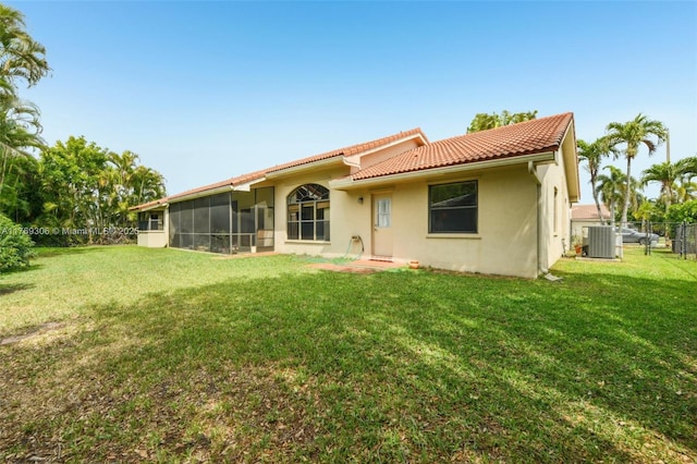 19460 NW 8th St, Pembroke Pines, FL 33029 - rear view of property with central air condition unit, a tile roof, a sunroom, and stucco siding