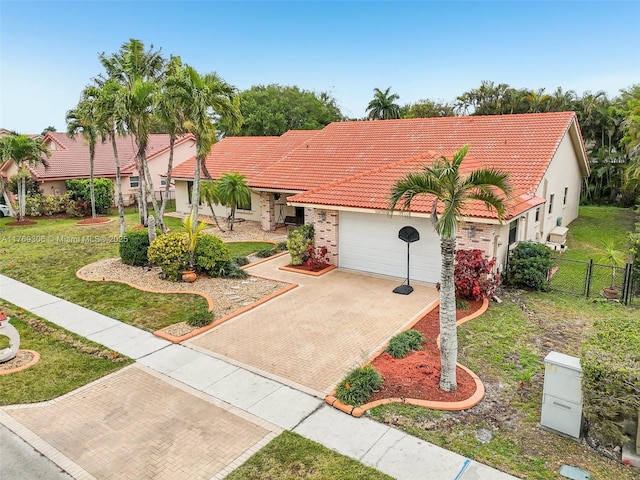 19460 NW 8th St, Pembroke Pines, FL 33029 - mediterranean / spanish-style home with a tile roof, a garage, decorative driveway, stucco siding, and a gate
