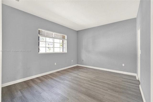 374 NE 26th Ave Unit 203, Homestead, FL 33033 - unfurnished room featuring baseboards and wood finished floors