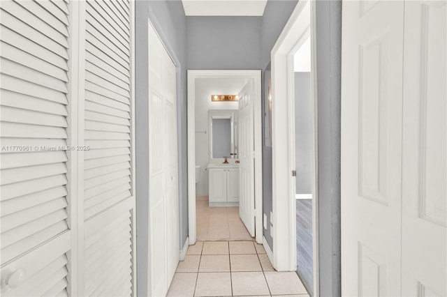 374 NE 26th Ave Unit 203, Homestead, FL 33033 - hallway with light tile patterned floors and a sink