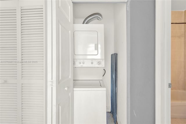 374 NE 26th Ave Unit 203, Homestead, FL 33033 - clothes washing area featuring stacked washer and clothes dryer and laundry area