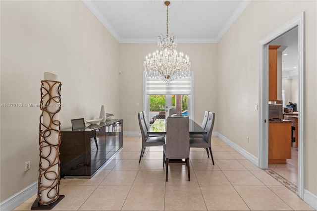 dining room with a chandelier, ornamental molding, light tile patterned flooring, and baseboards