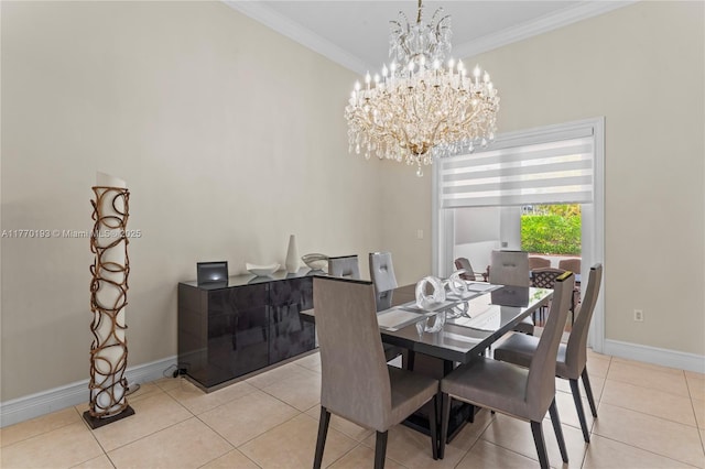 dining space with a chandelier, ornamental molding, baseboards, and light tile patterned flooring