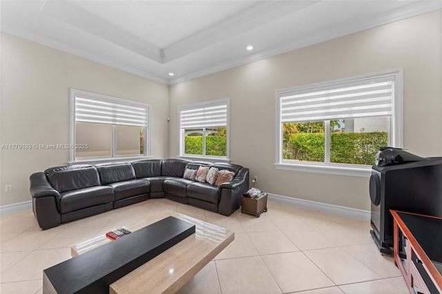 living room featuring ornamental molding, light tile patterned floors, recessed lighting, baseboards, and a tray ceiling