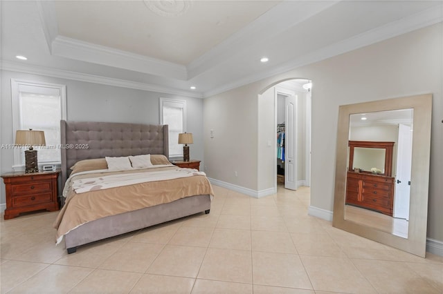 bedroom with arched walkways, recessed lighting, ornamental molding, a raised ceiling, and baseboards
