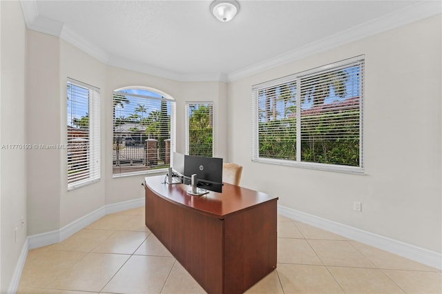 office space featuring crown molding, light tile patterned floors, and baseboards