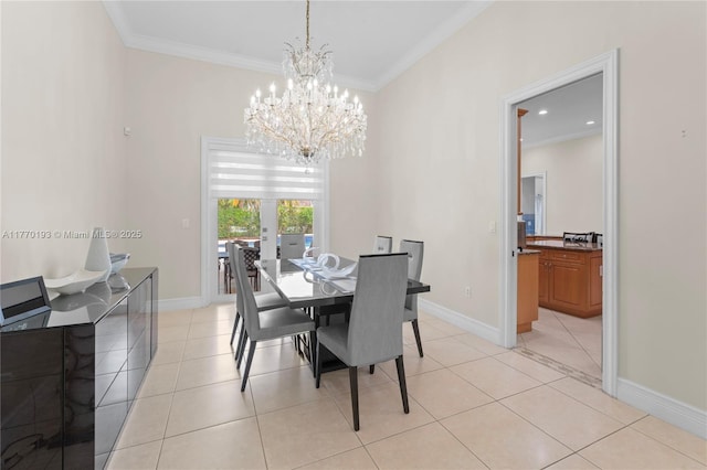 dining space featuring a chandelier, light tile patterned floors, crown molding, and baseboards