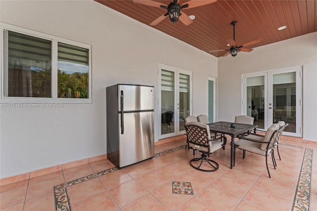 view of patio with french doors, ceiling fan, and outdoor dining space