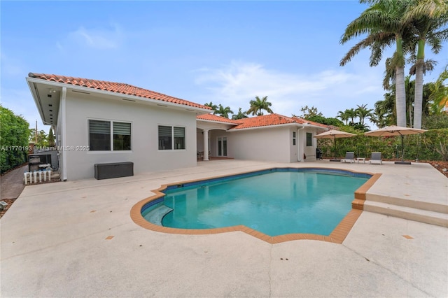 outdoor pool featuring a patio area