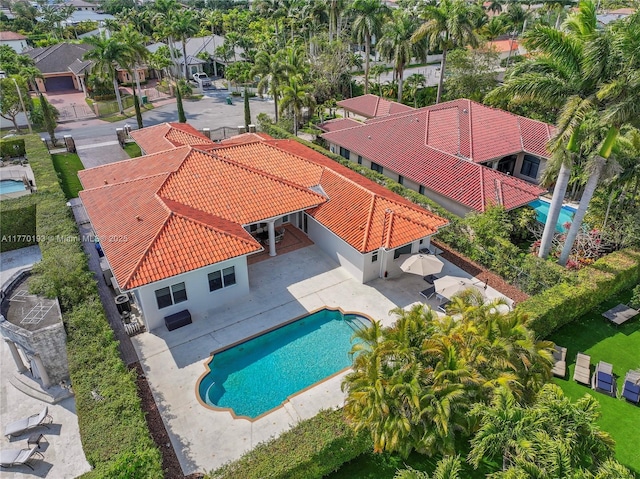 aerial view of residential area with a pool area