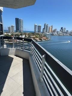 19101 NE Mystic Pointe Dr Unit 1601, Aventura, FL 33180 - balcony featuring a view of skyline and a water view
