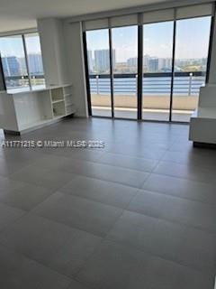 19101 NE Mystic Pointe Dr Unit 1601, Aventura, FL 33180 - unfurnished living room featuring a water view