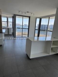 19101 NE Mystic Pointe Dr Unit 1601, Aventura, FL 33180 - kitchen with healthy amount of natural light and track lighting