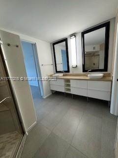 19101 NE Mystic Pointe Dr Unit 1601, Aventura, FL 33180 - full bath with a stall shower and double vanity