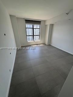 19101 NE Mystic Pointe Dr Unit 1601, Aventura, FL 33180 - spare room with baseboards