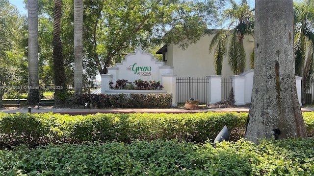 community sign featuring fence