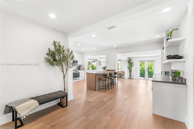 3291 SW 16th Ln, Miami, FL 33145 - entryway with french doors, light wood-style flooring, recessed lighting, and baseboards