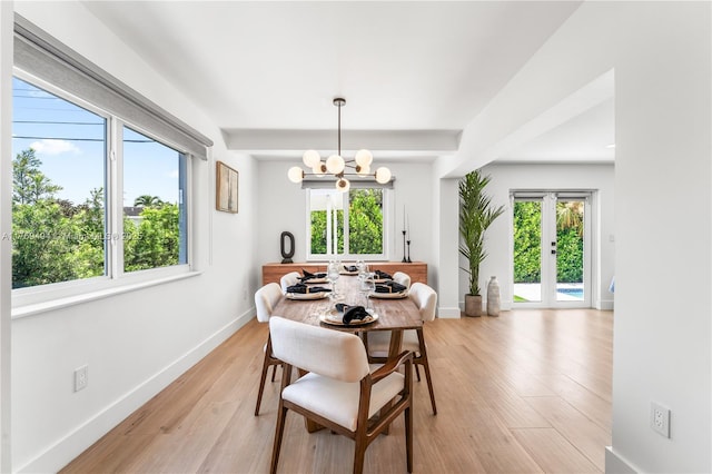 3291 SW 16th Ln, Miami, FL 33145 - dining room featuring healthy amount of natural light, a chandelier, light wood finished floors, baseboards, and beamed ceiling