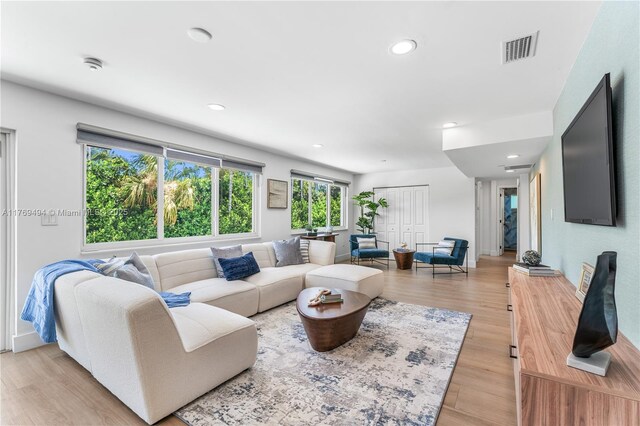 3291 SW 16th Ln, Miami, FL 33145 - living area featuring light wood-style flooring and recessed lighting