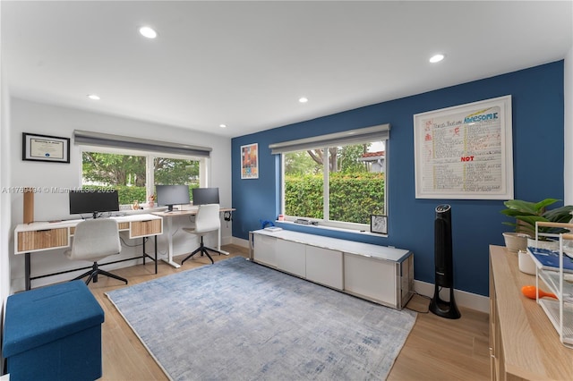 office space featuring baseboards, recessed lighting, and wood finished floors