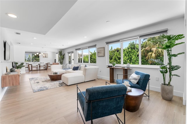 3291 SW 16th Ln, Miami, FL 33145 - living room featuring healthy amount of natural light, recessed lighting, a chandelier, and baseboards