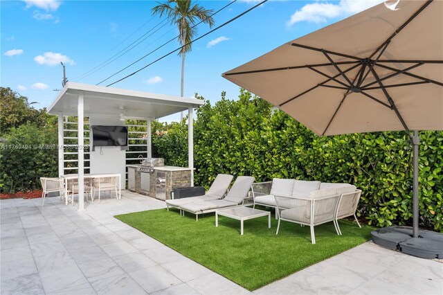 view of patio / terrace featuring a ceiling fan, area for grilling, and outdoor lounge area