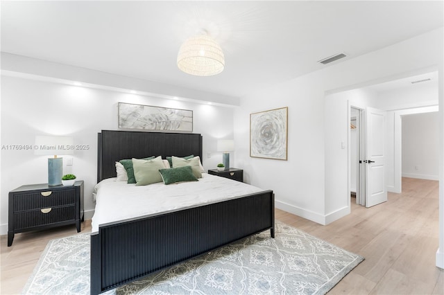 3291 SW 16th Ln, Miami, FL 33145 - bedroom with light wood-style flooring and baseboards